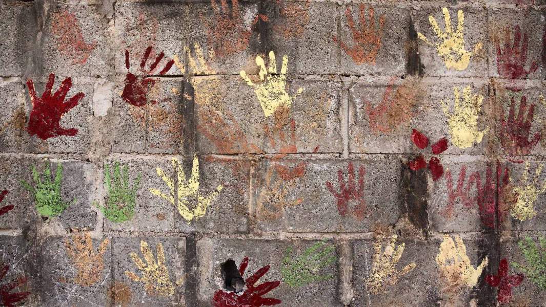 Imprints of children's hands on the wall in one of the camps for Syrian refugees in Jordan, 10 kilometers from the Syrian border