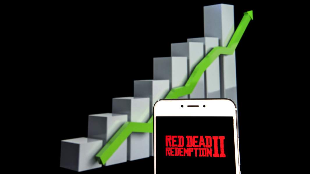 телефон с названием игры на фоне возрастающего графика 