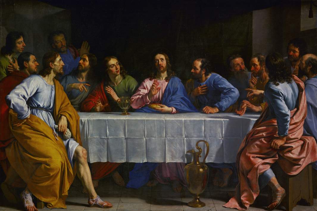 Иисус в окружении учеников благословляет вино и хлеб