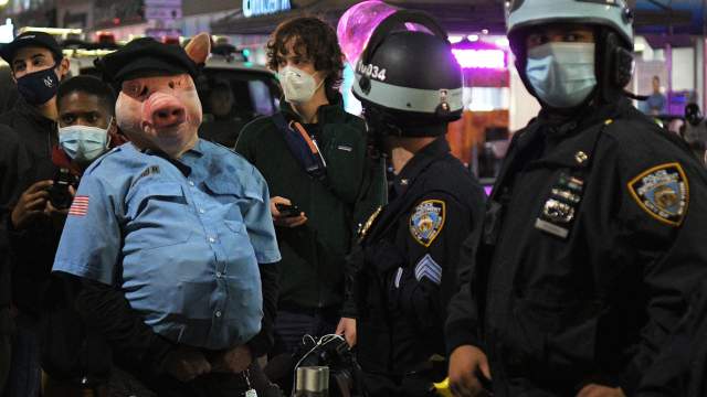 Police officers are cordoned off during a protest in New York