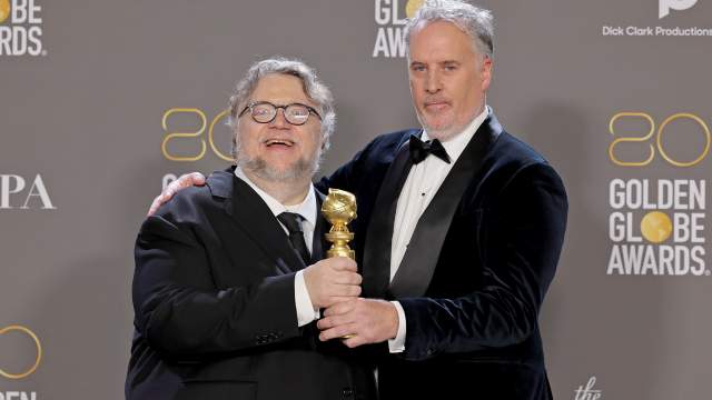 Guillermo del Toro and Mark Gustafson pose with the award for Best Animated Feature for "Guillermo del Toro's Pinocchio" in the press room during the 80th Annual Golden Globe Awards at The Beverly Hilton 