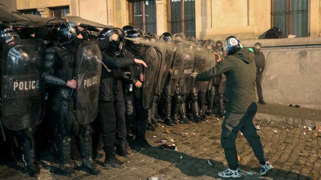 Police block the way and use tear gas to disperse protesters during a rally against the "foreign agents" law in Tbilisi, Georgia, March 7,
