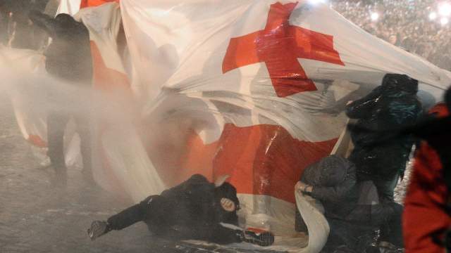 Police use a water cannon to disperse protesters during a rally against the "foreign agents" law in Tbilisi, Georgia, March 7