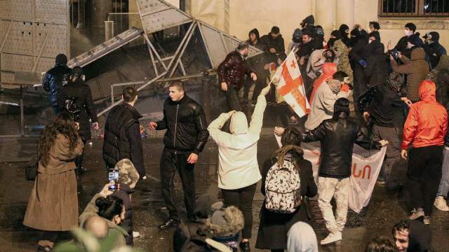 Police use a water cannon to disperse protesters, who gather in front of a gate of the parliament building during a rally against a draft law on "foreign agents", which critics say represents an authoritarian shift and could hurt Georgia's bid to join the European Union, in Tbilisi, Georgia, March 8