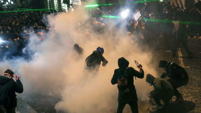 Police use stun grenades and tear gas to disperse protesters, who gather near the parliament building to protest against a draft law on "foreign agents", which critics say represents an authoritarian shift and could hurt Georgia's bid to join the European Union, in Tbilisi, Georgia, March 8