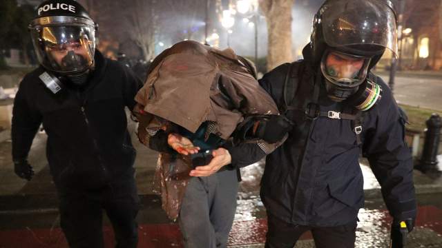 Law enforcement officers detain a person during a protest against a draft law on "foreign agents", which critics say represents an authoritarian shift and could hurt Georgia's bid to join the European Union, in Tbilisi, Georgia, March 8