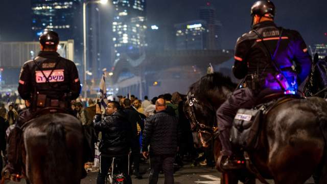 Tel Aviv: Israeli mounted police disperse anti-government protesters who took to the streets, following Netanyahu's dismissal of Defence Minister Galant. Angry protests broke out in�Tel Aviv on Sunday night following Israeli Prime Minister Benjamin Netanyahu's dismissal of Defence Minister Yoav Galant which came after he called on the government to halt its controversial judicial reform