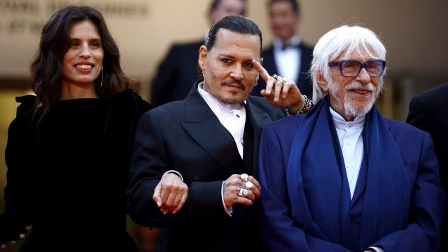 The 76th Cannes Film Festival - Opening ceremony and screening of the film "Jeanne du Barry" Out of competition - Red Carpet arrivals - Cannes, France, May 16, 2023. Johnny Depp, Maiwenn and Pierre Richard pose. REUTERS/Sarah Meyssonnier