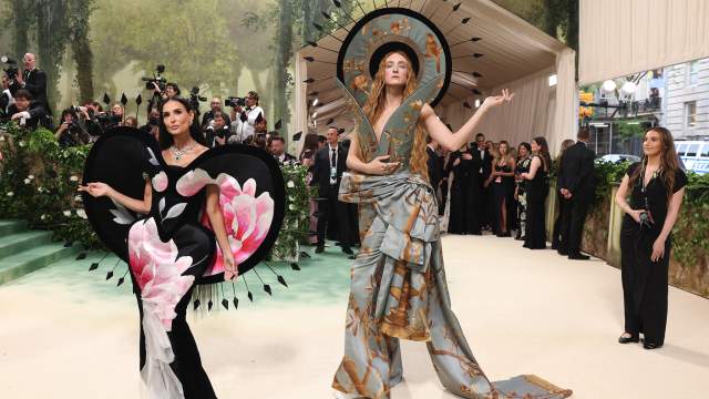 U.S. actress Demi Moore and U.S.-British fashion designer Harris Reed pose at the Met Gala,
