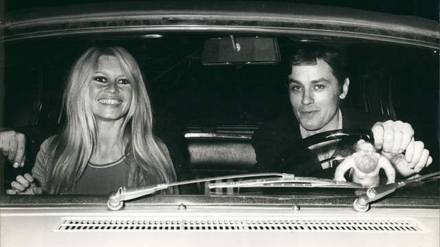 French actors BRIGITTE BARDOT and ALAIN DELON going to a dinner at the home of a friend