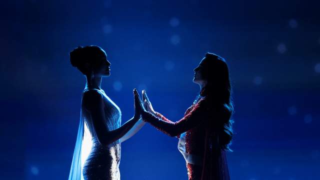 Praveenar Singh of Thailand and Fatima Bosch of Mexico hold hands as they wait for the announcement of the winner of the 74th Miss Universe pageant, in Bangkok, Thailand, November 21, 2025