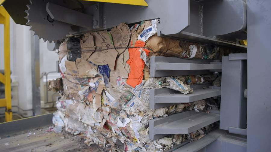 Pressed waste paper at a waste recycling facility