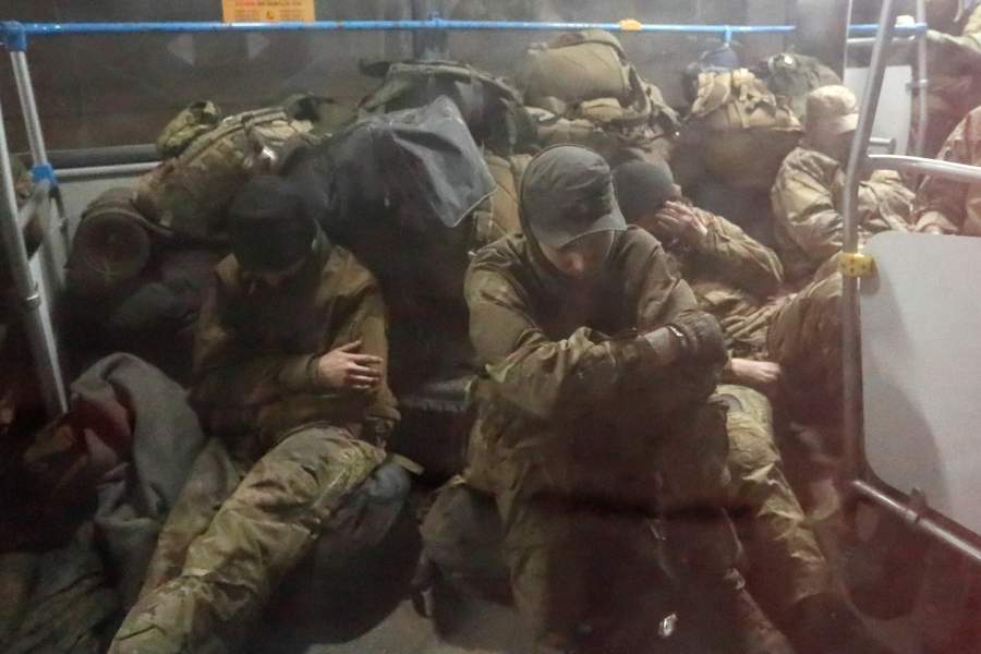 Service members of the Ukrainian armed forces, who surrendered at the besieged Azovstal steel mill in Mariupol in the course of Ukraine-Russia conflict, sit in a bus upon their arrival under escort of the pro-Russian military in the settlement of Olenivka in the Donetsk region