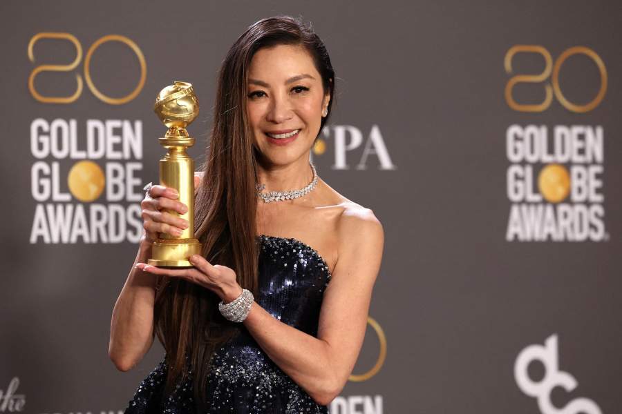 Michelle Yeoh poses with her award for Best Actress in a Musical or Comedy Motion Picture for "Everything Everywhere All at Once" at the 80th Annual Golden Globe Awards in Beverly Hills