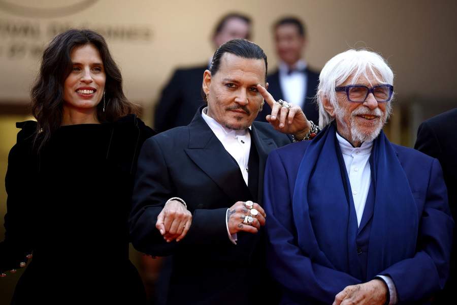 The 76th Cannes Film Festival - Opening ceremony and screening of the film "Jeanne du Barry" Out of competition - Red Carpet arrivals - Cannes, France, May 16, 2023. Johnny Depp, Maiwenn and Pierre Richard pose. REUTERS/Sarah Meyssonnier