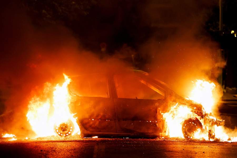 A vehicle burns during clashes between protesters and police, following the death of Nahel, a 17-year-old teenager killed by a French police officer during a traffic stop, in Nanterre, Paris suburb, France, June 29, 2023.