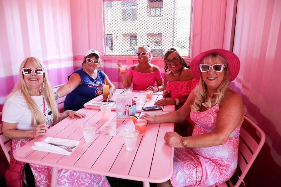 A woman celebrates her birthday with her friends as they have a full Barbie experience while they dine at the newly opened Malibu Barbie CafŽ Chicago located on the cityÕs Near West Side on July 21, 2023. The cafŽ has Barbie themed features such as a life-sized Barbie Toy Box, a Malibu Skate Rink, A Barbie Phone, a moving Wave Arch, and the cafŽ dŽcor is pink. The CafŽ will be open through October. (Photo By: Alexandra Buxbaum/Sipa USA) No Use Germany.