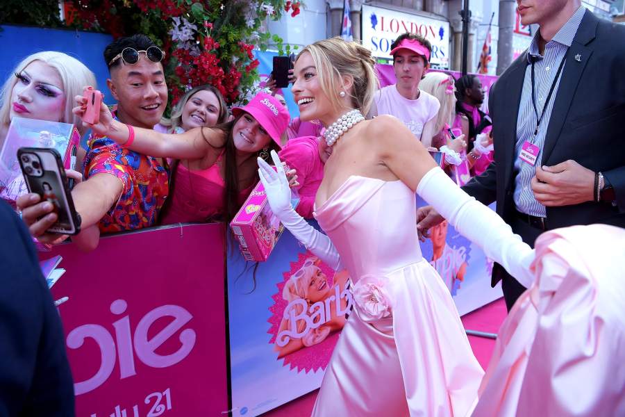 Warner Bros. Pictures Presents The European Premiere Of "Barbie" - Roaming LONDON, ENGLAND - JULY 12: Margot Robbie takes a selfie with fans during The European Premiere Of "Barbie" at Cineworld Leicester Square on July 12, 2023 in London, England. (Photo by Antony Jones/Getty Images for Warner Bros.)