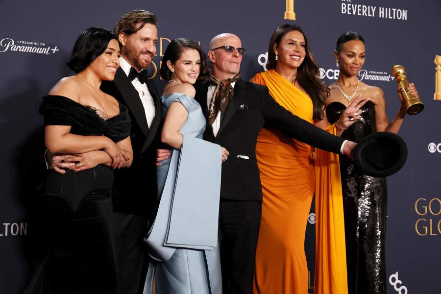 Adriana Paz, Édgar Ramírez, Selena Gomez, Jacques Audiard, Zoe Saldana and Karla Sofía Gascón, winners of the Best Motion Picture – Musical Or Comedy Award for "Emilia Pérez", pose in the press room during the 82nd Annual Golden Globe Awards at The Beverly Hilton