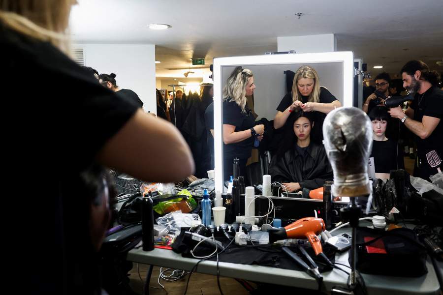 A model has her hair done backstage before the Weinsanto Fall/Winter 2025 collection show during Paris Fashion Week in Paris