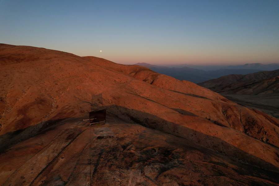 A drone view shows a fog catcher, a mesh suspended between two poles that intercept small bits of moisture to collect water from the air in the Atacama Desert, in Chanaral, Chile 