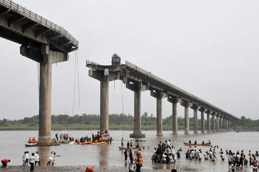 Rescuers search for survivors after a bridge collapsed in Vadodara in the western state of Gujarat, India, July 9