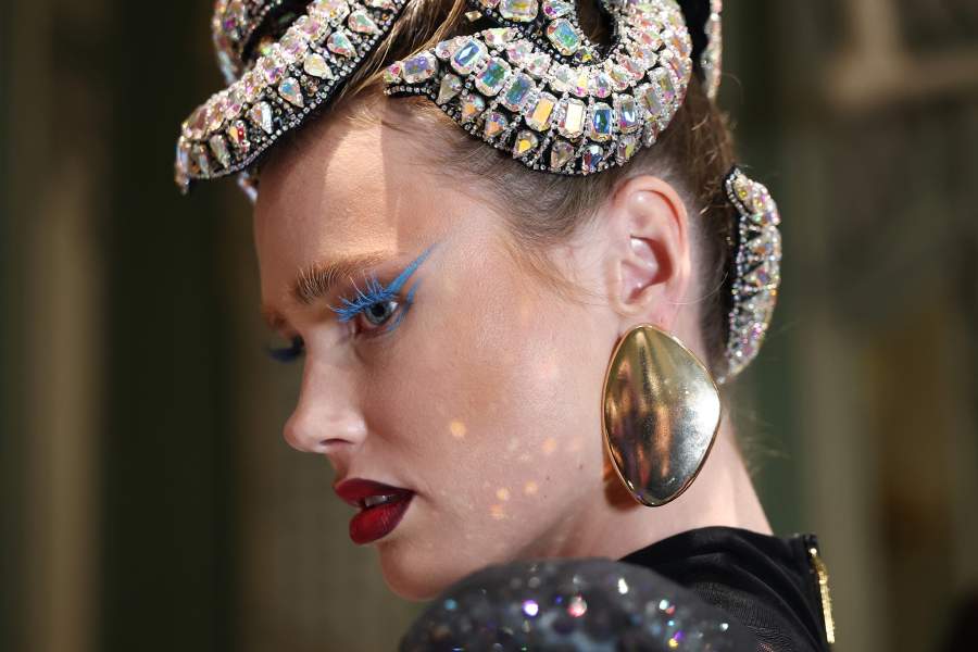 NEW YORK, NEW YORK - SEPTEMBER 15: A model prepares backstage at The Blonds fashion show during September 2025 New York Fashion Week on September 15, 2025 in New York City. (Photo by Cindy Ord/Getty Images)