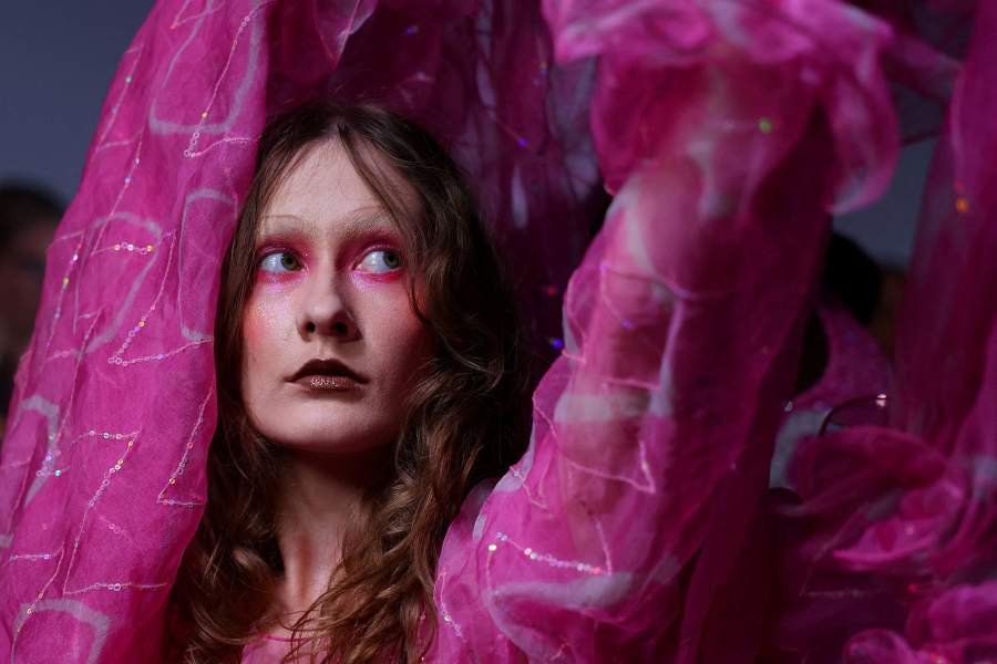 A model poses for a photo backstage ahead of the Ashish SS26 catwalk show during London Fashion Week in London, Britain, September 22, 2025