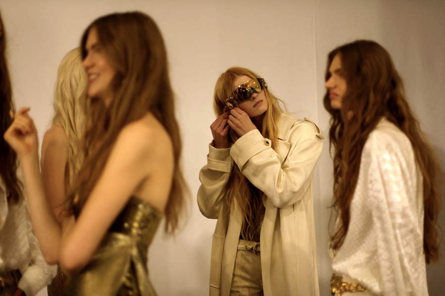 Models prepare backstage of the Roberto Cavalli Spring/Summer 2026 collection show during Milan Fashion Week, in Milan, Italy, September 25, 2025.