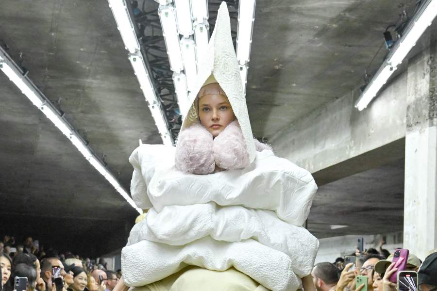 PARIS, FRANCE - OCTOBER 04: A model walks the runway during the Comme des Garçons Ready to Wear Spring/Summer 2026 fashion show as part of the Paris Fashion Week on October 4, 2025 in Paris, France. (Photo by Victor VIRGILE/Gamma-Rapho via Getty Images)