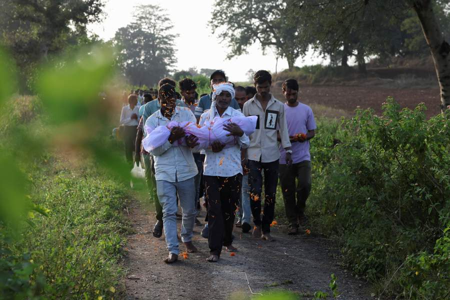 Family members carry the body of Nilesh Suryavanshi's three and a half year old child for the funeral, in a village in Parasia, India, October 9, 2025. The child died after being admitted to a hospital following the consumption of Coldrif cough syrup, which has been linked to the deaths of several children