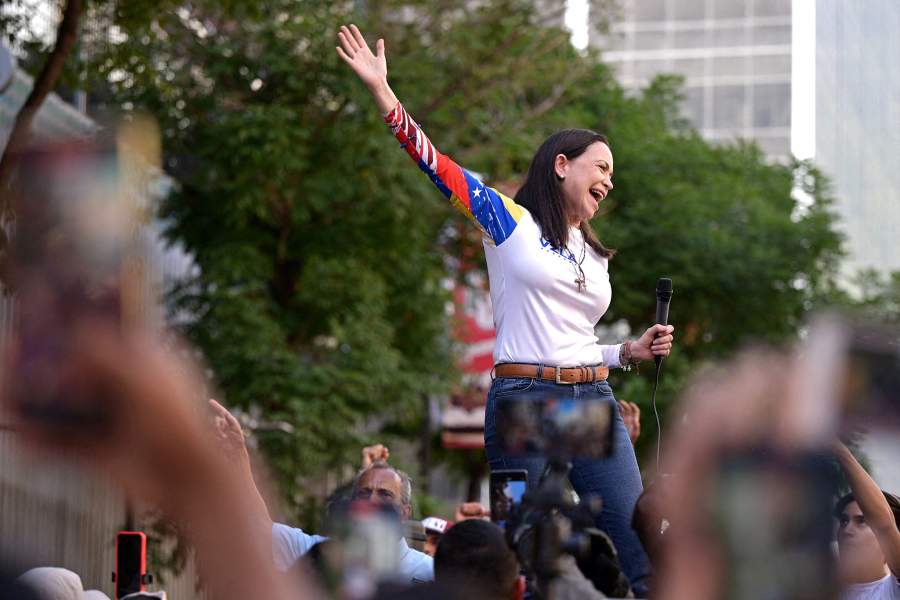 Venezuelan opposition leader Maria Corina Machado gestures as she addresses supporters at a protest ahead of the Friday inauguration of President Nicolas Maduro for his third term, in Caracas,