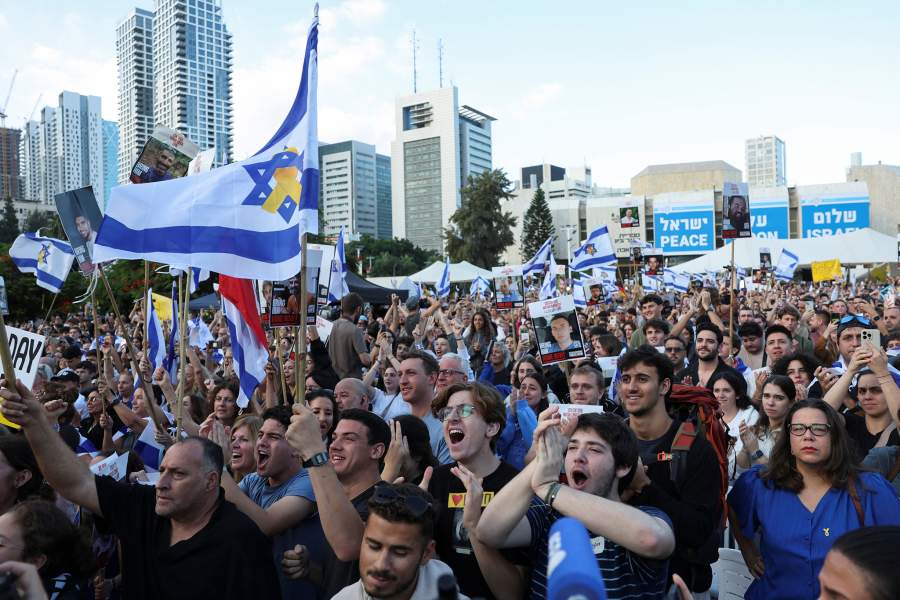 People gather at "Hostages Square" to await the expected return of Israeli hostages, who have been held in Gaza since the deadly October 7, 2023 attack by Hamas, as part of a prisoner-hostage swap and a ceasefire deal between Israel and Hamas, in Tel Aviv, Israel, October 13, 2025