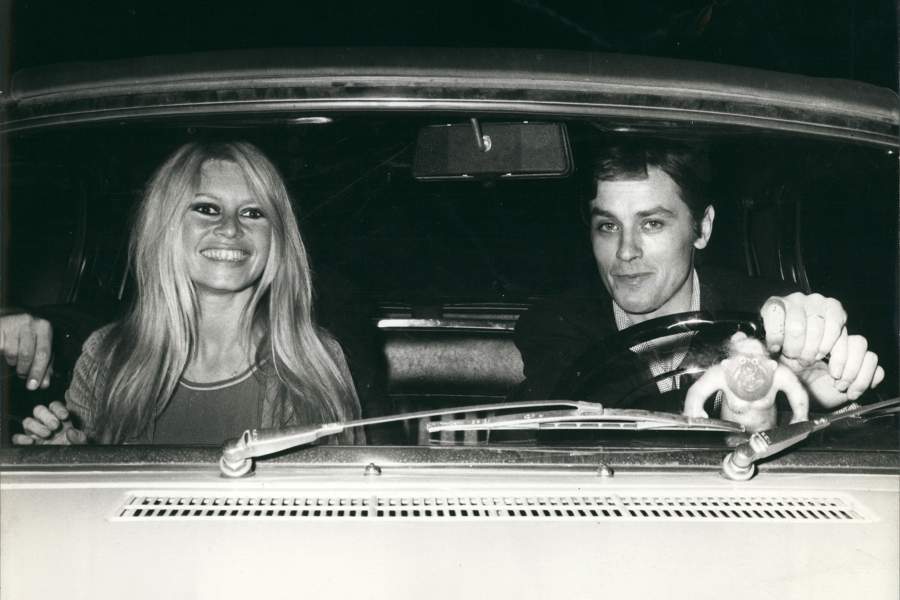 French actors BRIGITTE BARDOT and ALAIN DELON going to a dinner at the home of a friend