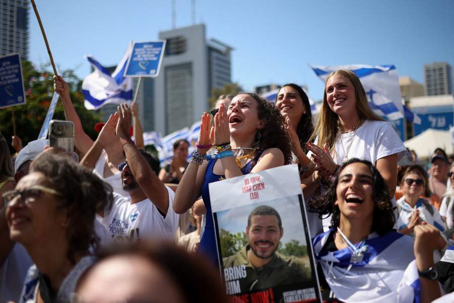 People react at "Hostages Square" as Hamas releases hostages, who have been held in Gaza since the deadly October 7, 2023 attack by Hamas, as part of a hostages-prisoners swap and a ceasefire deal between Israel and Hamas, in Tel Aviv, Israel, October 13, 2025. 
