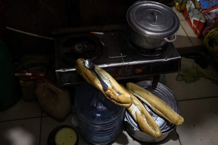 Sandwiches that Acceline Ngouana, 36, a trained nurse who left the profession due to meager pay, prepared for her daughters' breakfast before they go to school are seen at the back of her workshop where they live in Douala, Cameroon, October 6, 2025. Ngouana now works as a motorcycle taxi rider while running a small garage as a single mother of three. "I hope for change, and I will vote for change." she said, without didn’t specify which challenger she would back.