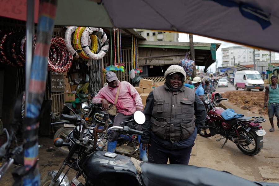 Carine Alphonsine Kegne, 39, a single mother of two and motorcycle taxi rider who abandoned her dream of becoming a professional football 