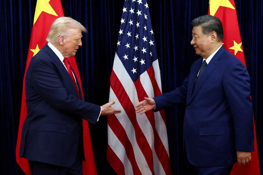 U.S. President Donald Trump shakes hands with Chinese President Xi Jinping as they hold a bilateral meeting at Gimhae International Airport, on the sidelines of the Asia-Pacific Economic Cooperation (APEC) summit, in Busan, South Korea, October 30, 2025