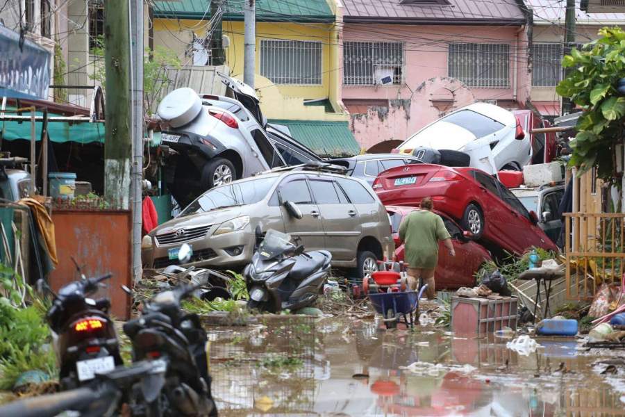 Vehicles lie piled on after flooding caused by Typhoon Kalmaegi in Cebu city, central Philippines, Tuesday, Nov. 4, 2025