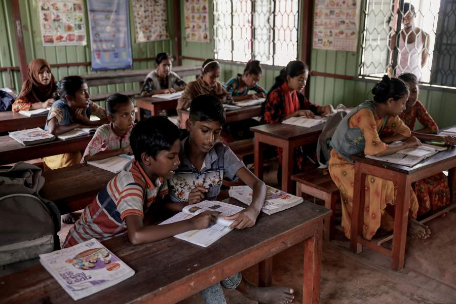 Children attend a class at the only school on Char Youthnet island, run by an NGO, in Kurigram, Bangladesh, October 28, 2025. REUTERS/Mohammad Ponir Hossain