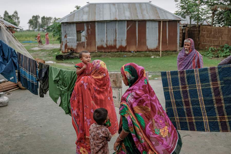 Kosim Uddin, 50, looks on as his granddaughter cries, a day before he moves his house to a new island on the Brahmaputra river, in Kurigram, Bangladesh, June 19, 2024. REUTERS/Mohammad Ponir Hossain