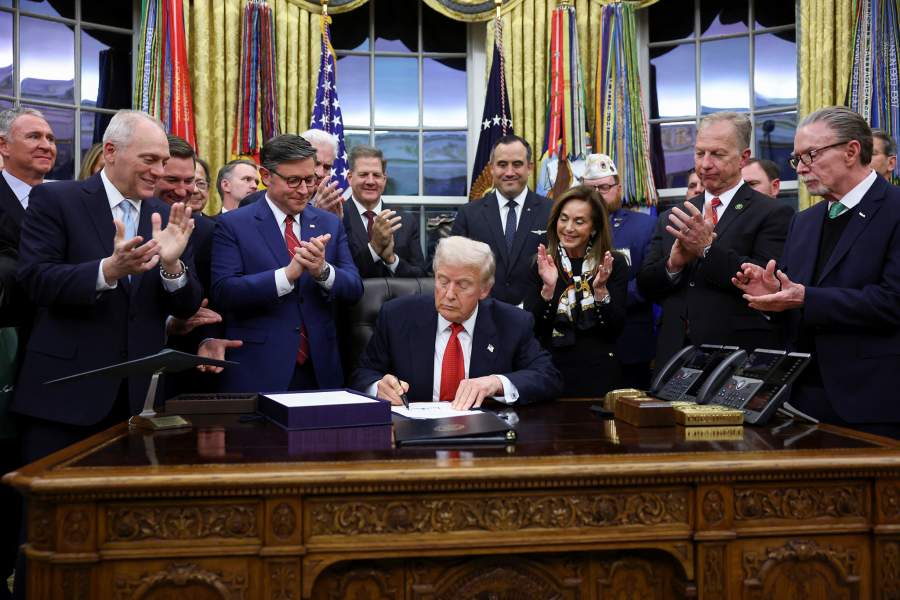President Donald Trump signs the funding bill to end the U.S. government shutdown, at the White House in Washington