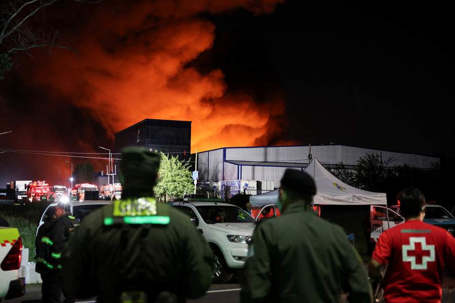 Smoke rises from a fire after an explosion occurred due to a fire in buildings containing agrochemical products in a factory complex in the town of Carlos Spegazzini, in the province of Buenos Aires, Argentina