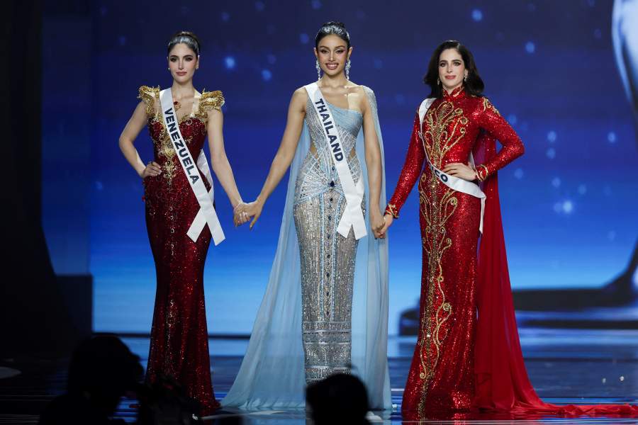 The top three contestants, Stephany Abasali of Venezuela, Praveenar Singh of Thailand, and Fatima Bosch of Mexico hold their hands during the 74th Miss Universe pageant in Bangkok, Thailand, November 21, 2025