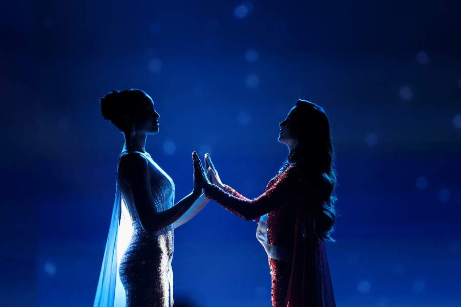 Praveenar Singh of Thailand and Fatima Bosch of Mexico hold hands as they wait for the announcement of the winner of the 74th Miss Universe pageant, in Bangkok, Thailand, November 21, 2025