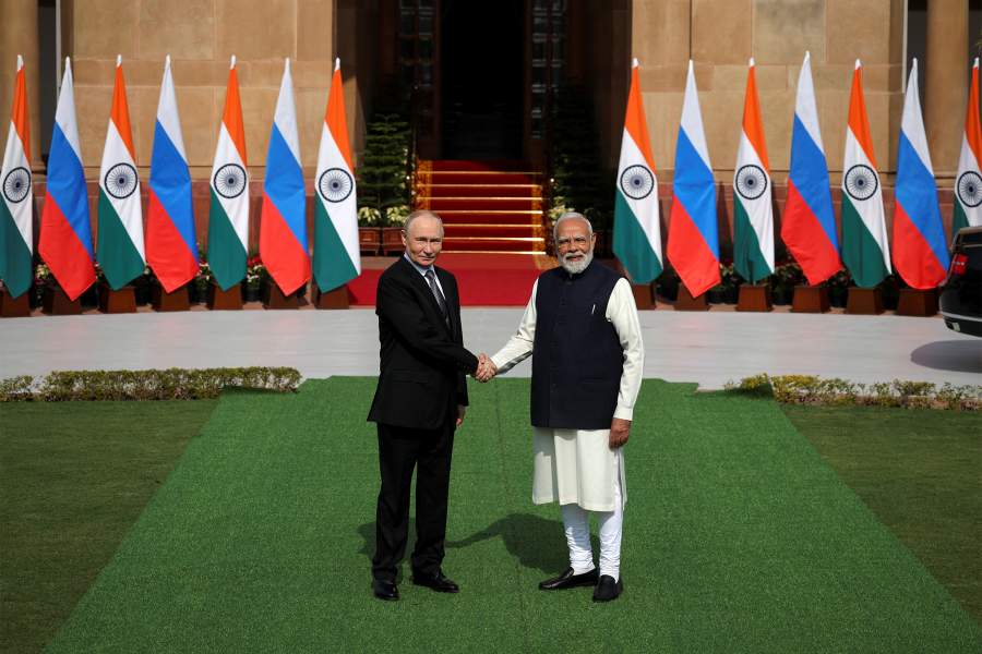 Russia's President Vladimir Putin shakes hands with India's Prime Minister Narendra Modi ahead of their meeting at Hyderabad House in New Delhi,