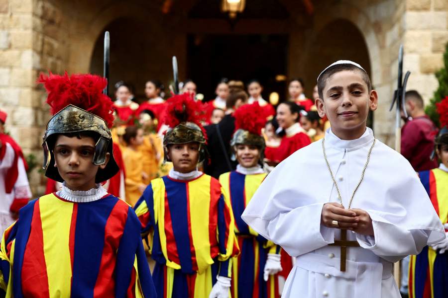 A child dressed as the pope and others as Swiss Guards, gather on the day Pope Leo XIV visits De La Croix Psychiatric Hospital during his first apostolic journey, in Jal el-Dib, Lebanon December 2, 2025.