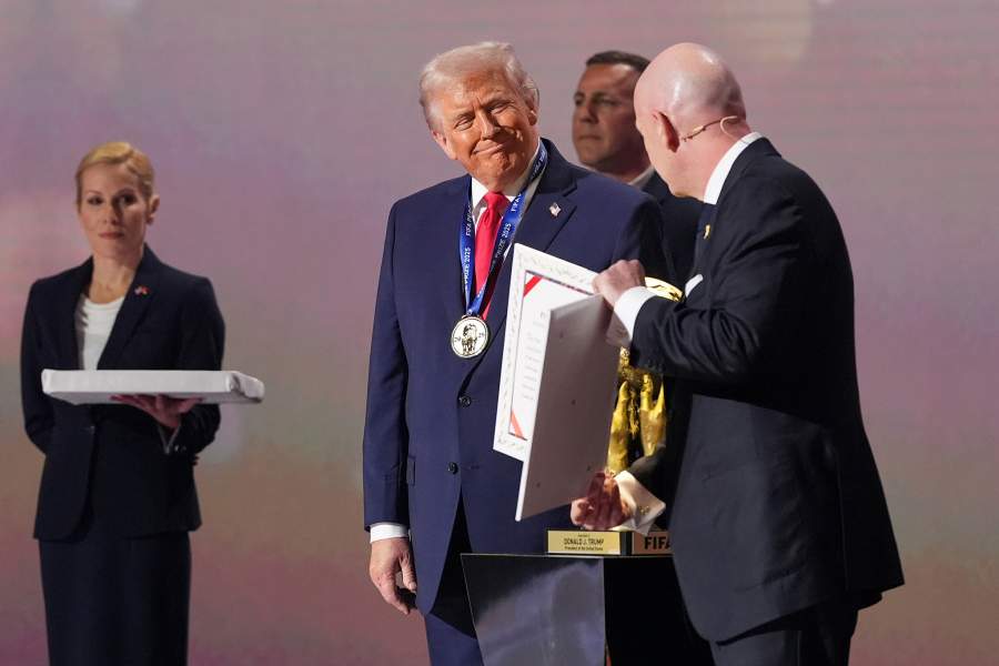 President Donald Trump receives the FIFA Peace Prize from FIFA President Gianni Infantino during the draw for the 2026 soccer World Cup at the Kennedy Center in Washington, Friday, Dec. 5, 2025.