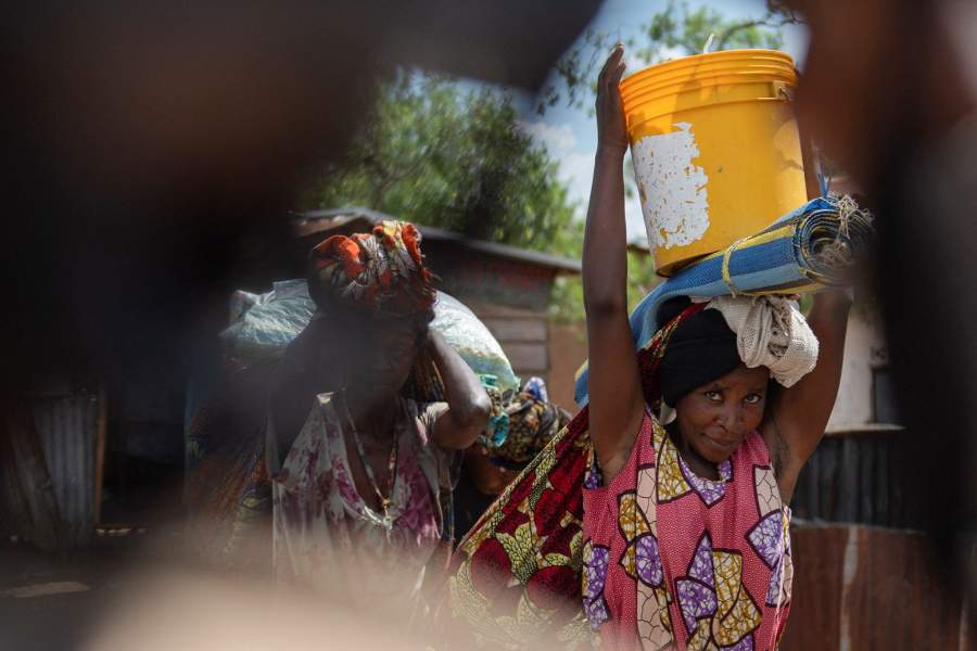Congolese people displaced during renewed clashes between Alliance Fleuve Congo AFC/M23 and the Armed Forces of the Democratic Republic of the Congo (FARDC), walk back to their homes from Sange, in Luvungi, a settlement north of Uvira, South Kivu province, in the Democratic Republic of Congo, December 13, 2025. REUTERS/Stringer