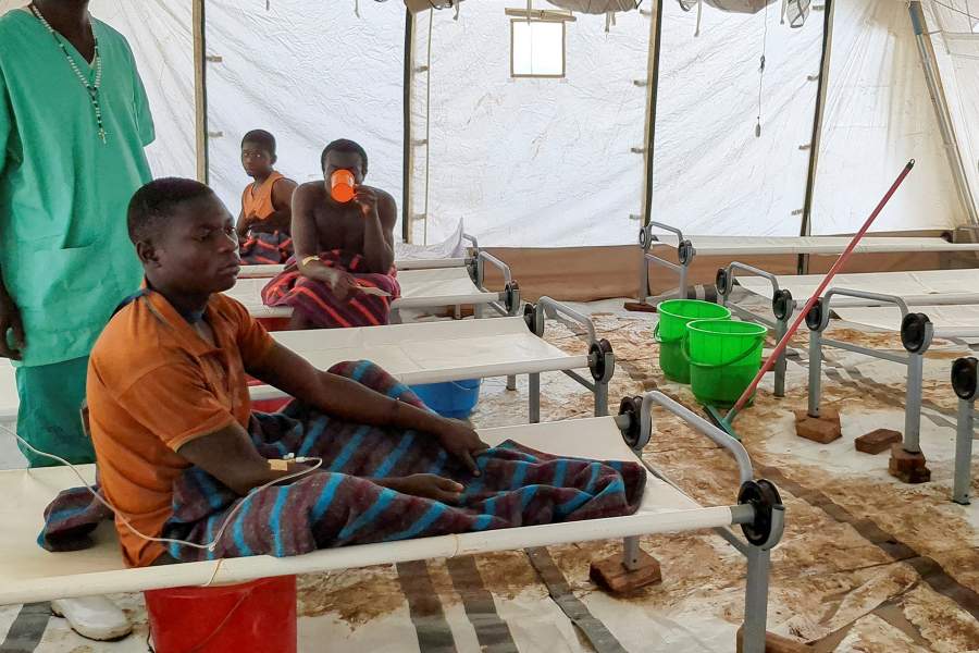 FILE PHOTO: Artisanal gold miners sit inside a ward at the cholera treatment centre run by Medecins Sans Frontieres (MSF - Doctors without Borders) following a cholera outbreak that has swept through, overwhelming a fragile health system and underscoring the risks faced by thousands of miners and traders living without clean water or sanitation, in Lomera within Luhihi mi